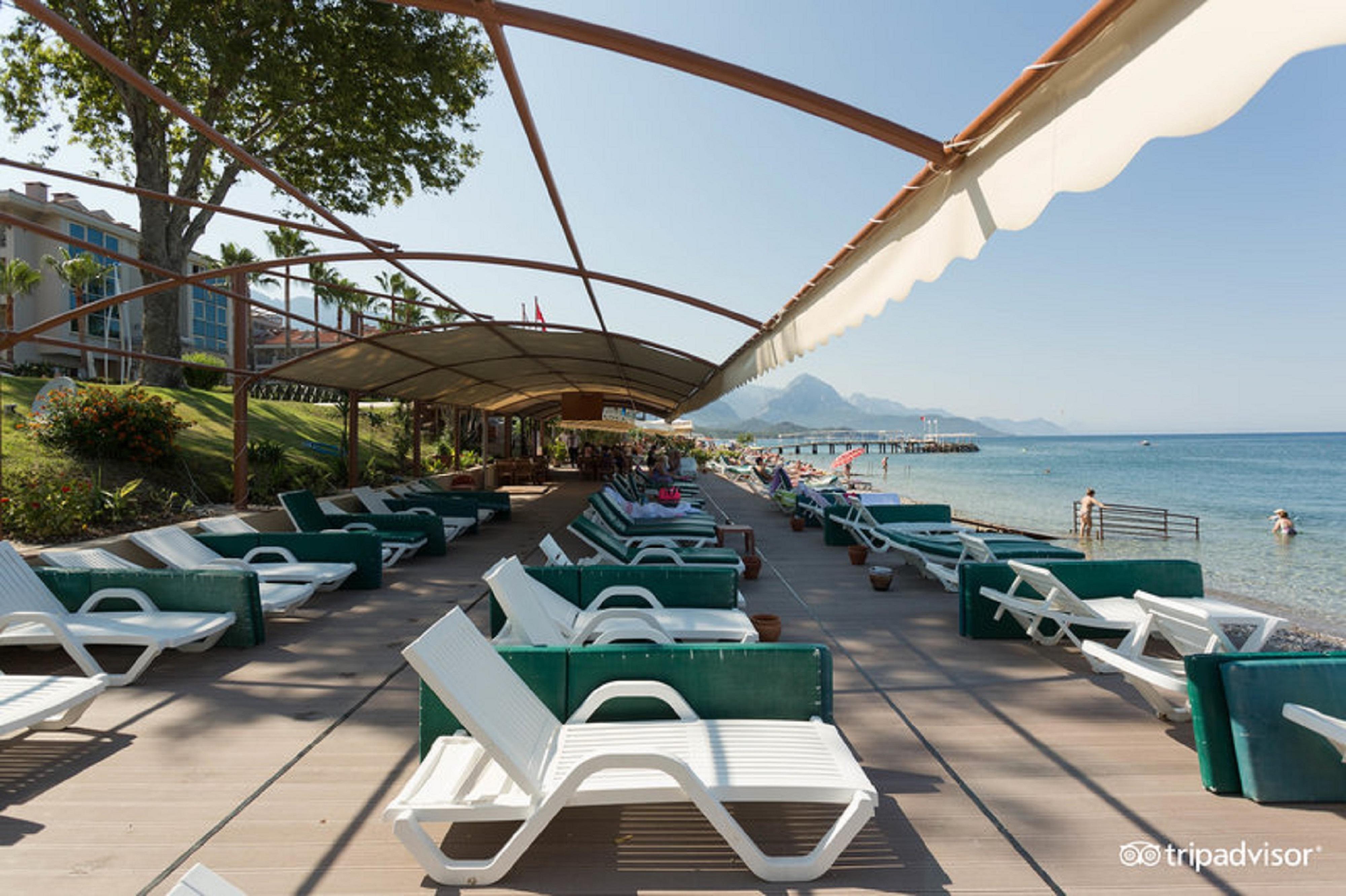 Ambassador hotel kemer 4. Амбассадор отель Турция Кемер. Амбассадор Плаза отель Кемер. Кемер отель Амбассадор 4 звезды. Ambassador Plaza Hotel 4 пляж.